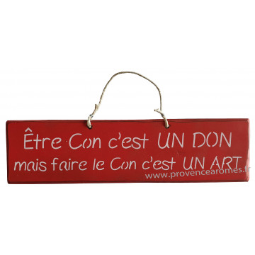 Plaque en bois " Être con c'est un don mais faire le con c'est un art " fond rouge